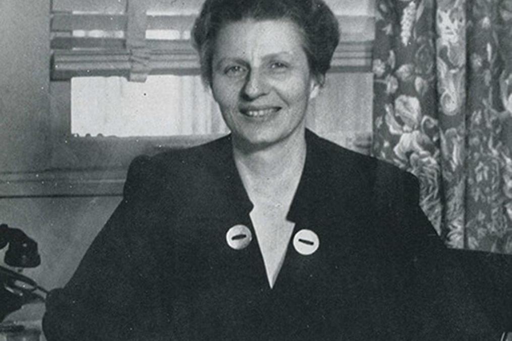 Dr. Katherine Gillette Blyley sitting behind a desk