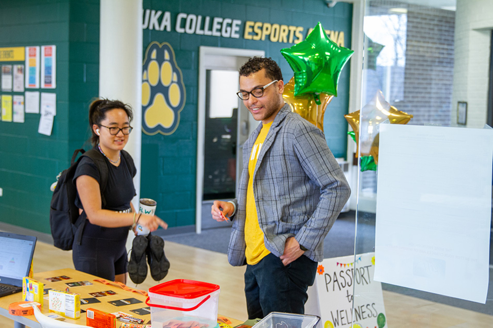 Student Life staff with student in Dahlstrom Student Center 