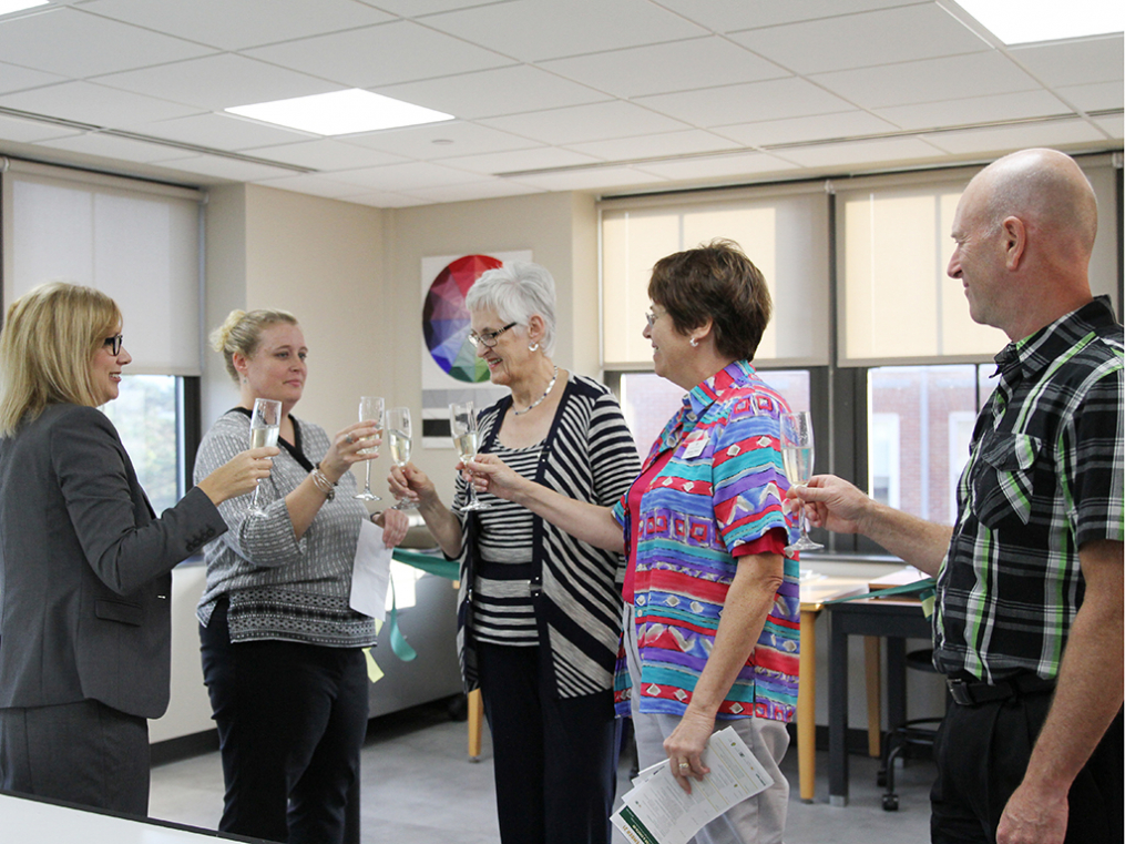 Keuka College Board of Trustees Vice Chair Aqua Porter chats with art students during the opening reception for the new Center for Arts & Design.