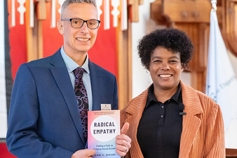 Dr. Brad Fuster and Dr. Terri Givens posed with Dr. Givens' book
